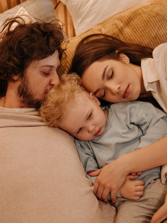 A family embracing at home
